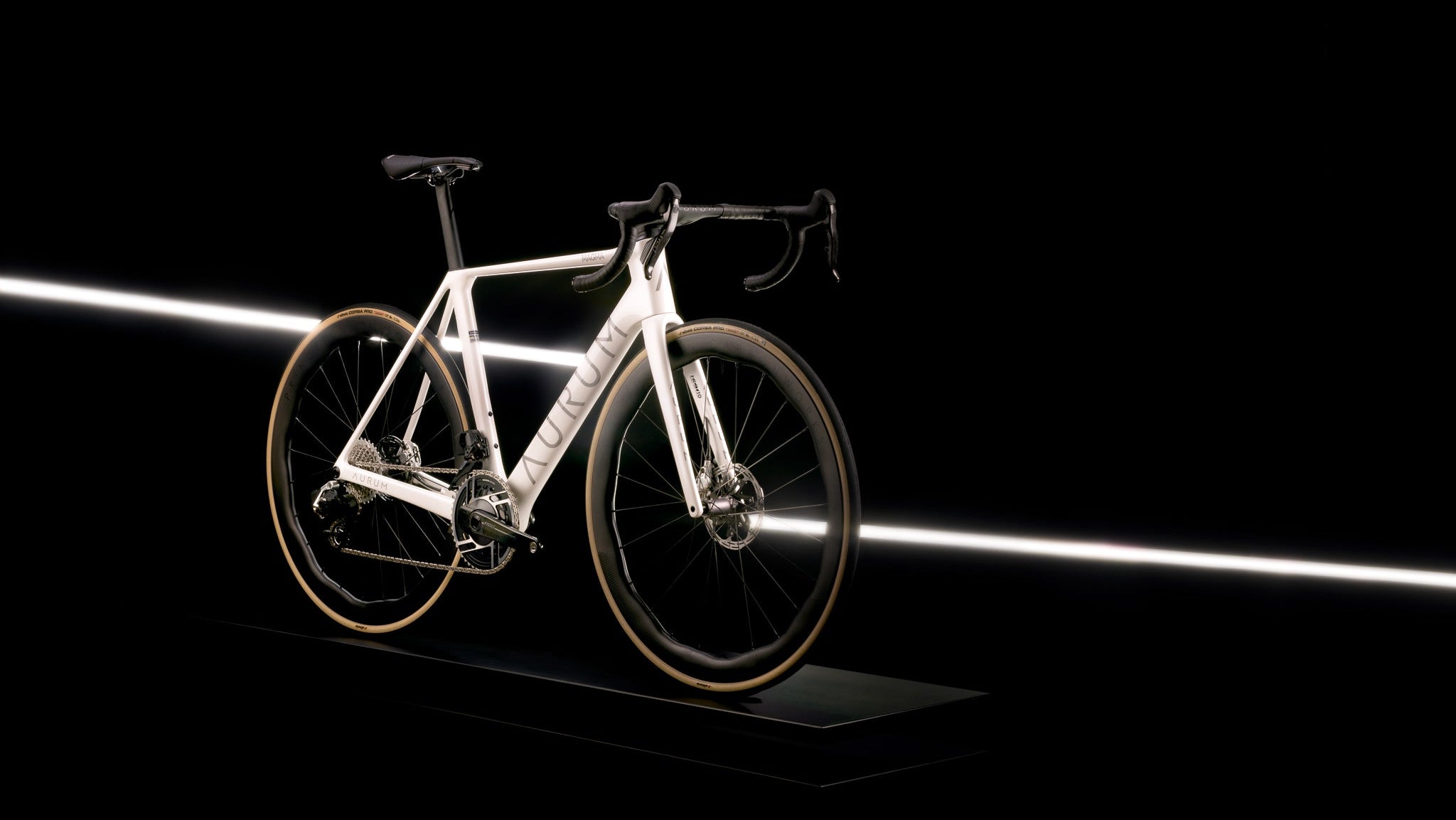 White bicycle on a black background with a spotlight effect